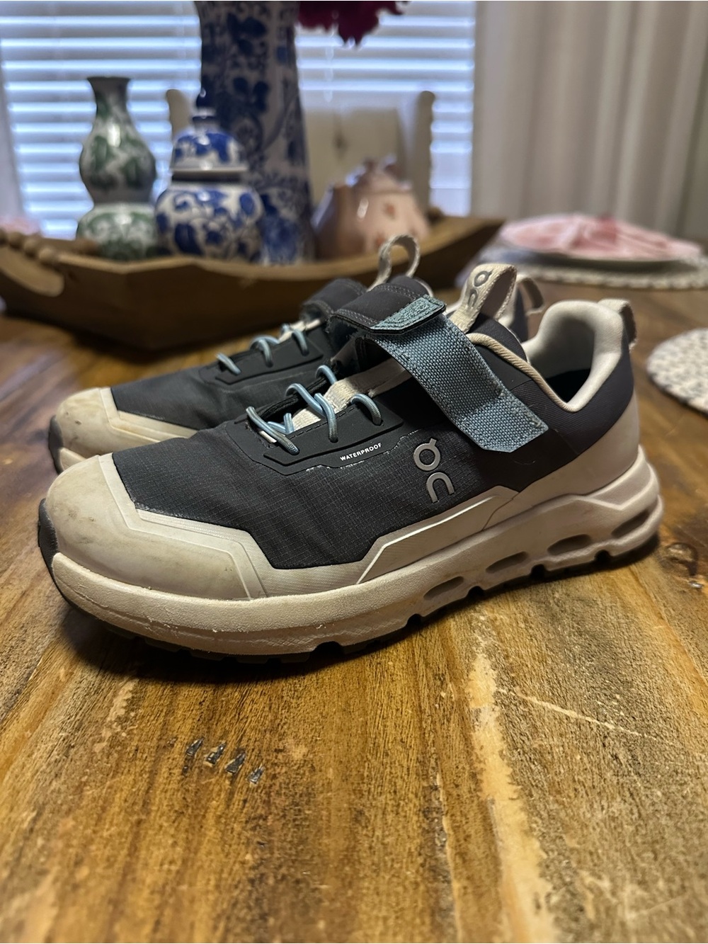 On Running Kids Sneakers in Black and Cream with Light Blue Accents